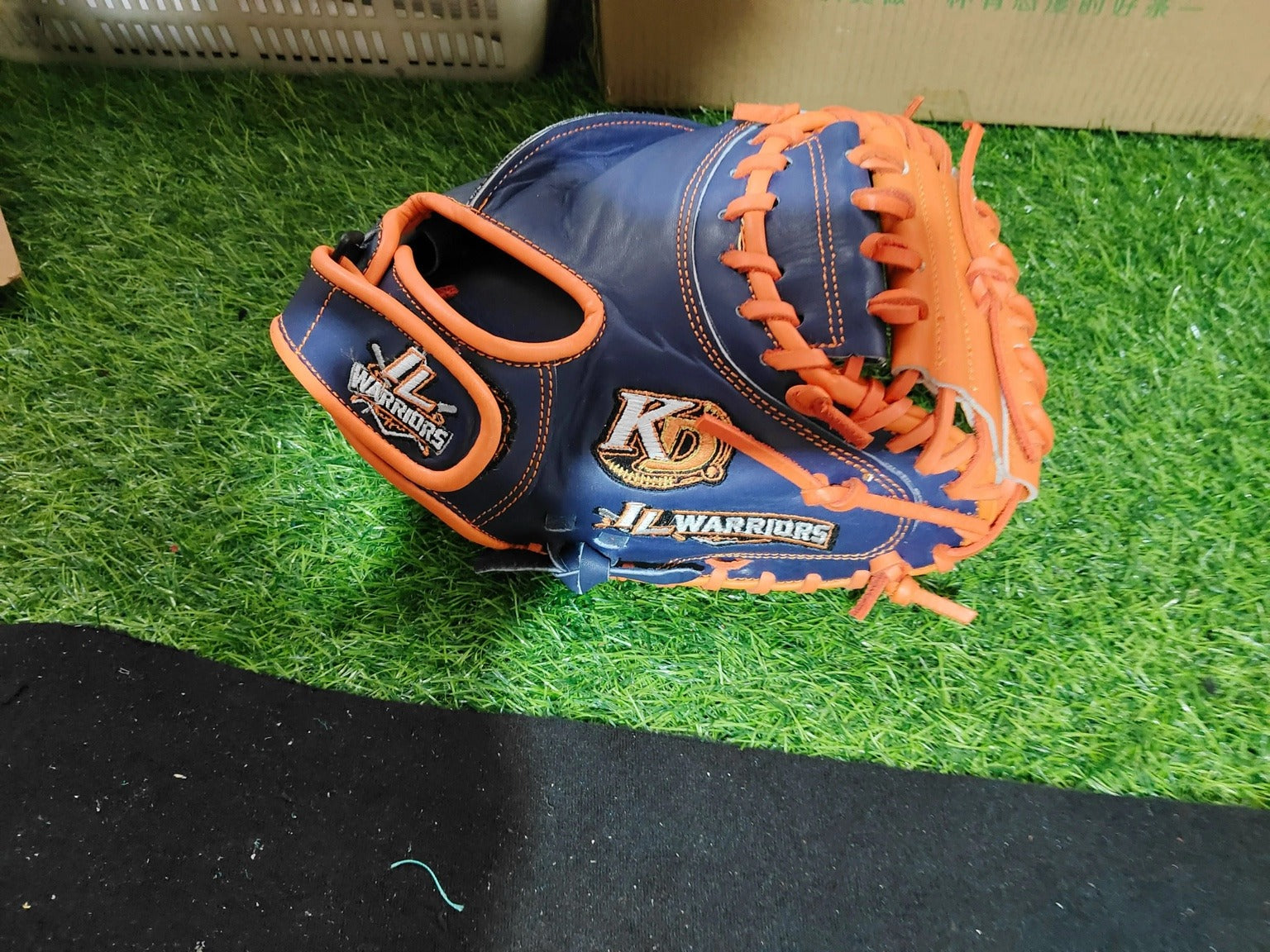 JL Warriors navy and orange glove